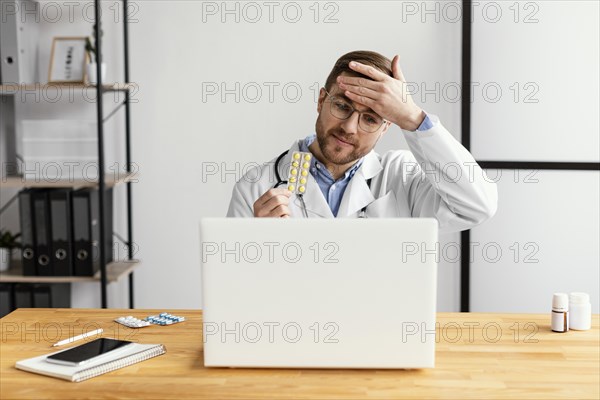 Medium shot doctor holding medicine