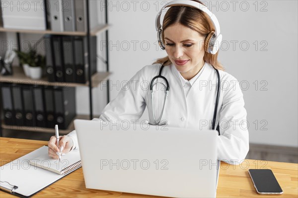 Medium shot doctor with headphones