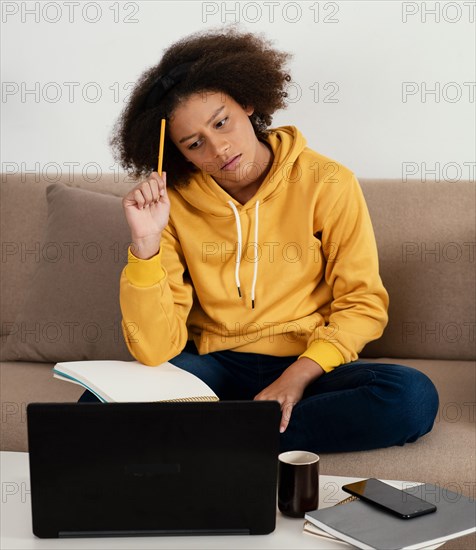 Medium shot girl holding pen