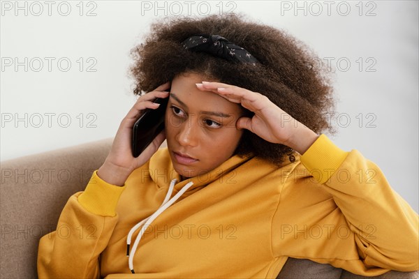 Medium shot girl talking phone