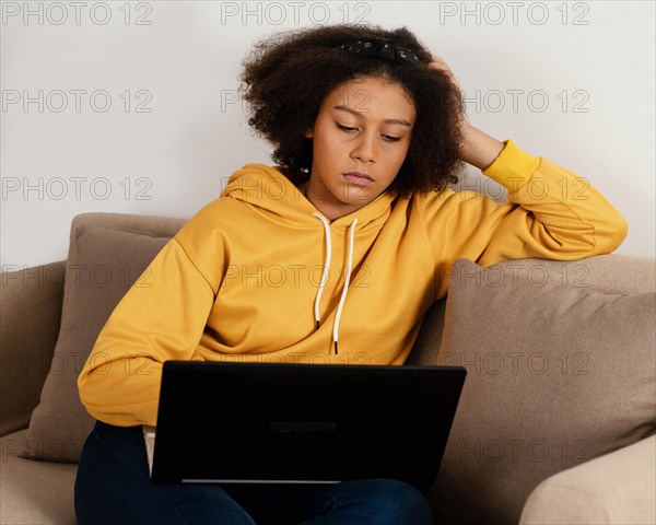 Medium shot girl with laptop