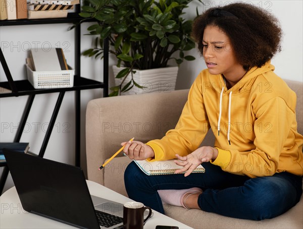 Medium shot girl with notebook