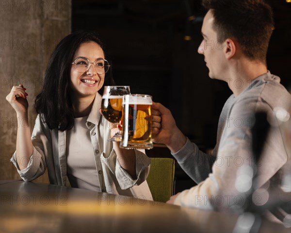 Medium shot people with beer mugs