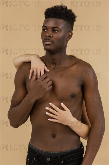 Medium shot white hands holding black man