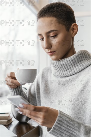 Medium shot woman holding cup 2