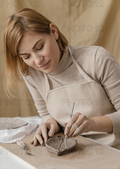 Medium shot woman holding wire