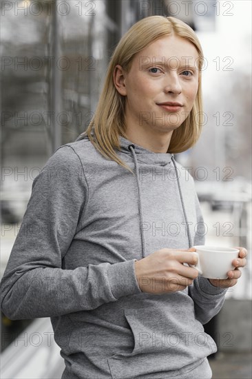 Medium shot woman with cup