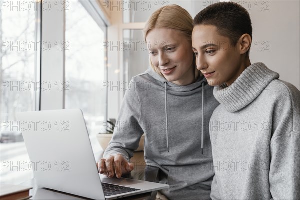 Medium shot women with laptop