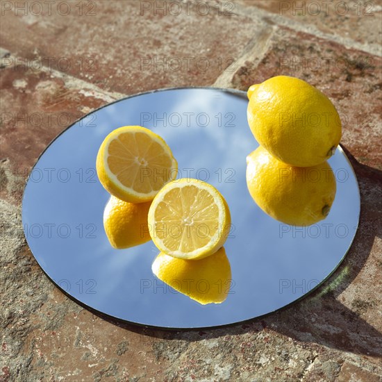 Mirror with fresh lemons 2