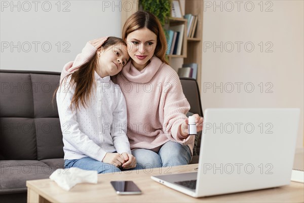 Patients consulting doctor with laptop