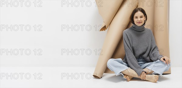 Portrait beautiful young female sitting floor
