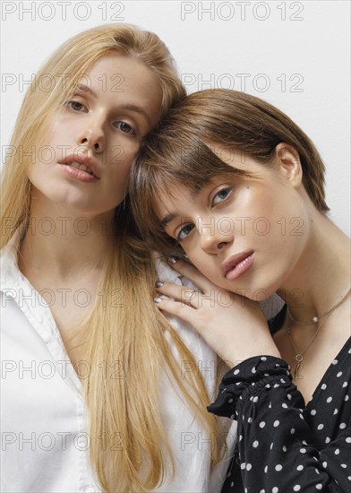 Portrait beautiful young females posing