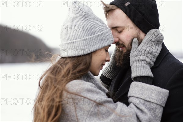 Side view young couple hugging 2