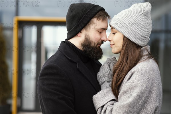 Side view young couple hugging 3