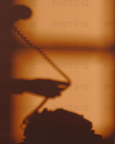 Silhouette woman using telephone 2