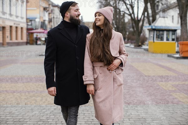 Smiley couple holding hands