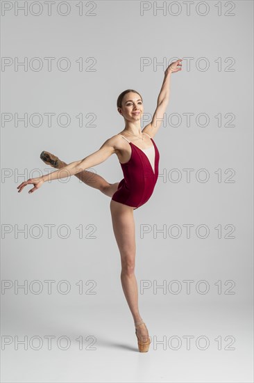 Talented ballerina performing full shot