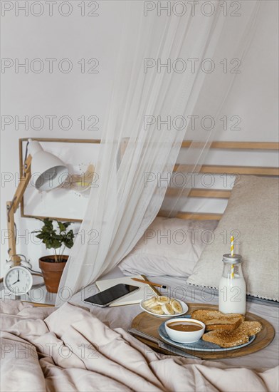 Tasty breakfast bed high angle