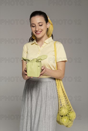 Woman holding reusable napking turtle bag