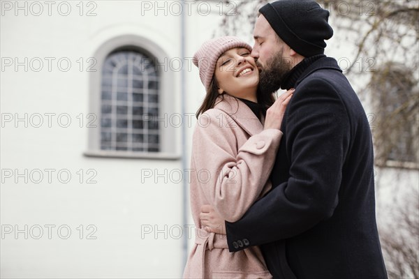 Young couple outdoor kissing