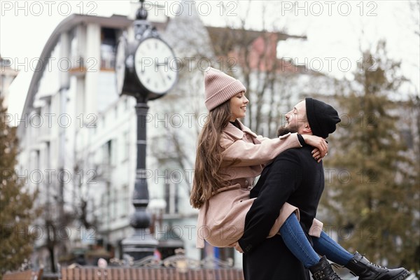 Young couple piggy back ride 2