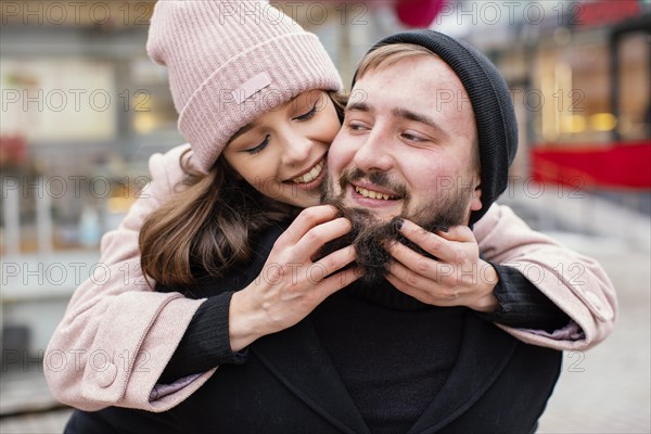 Young couple piggy back ride 3