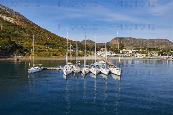 Sailboats in a row next to each other