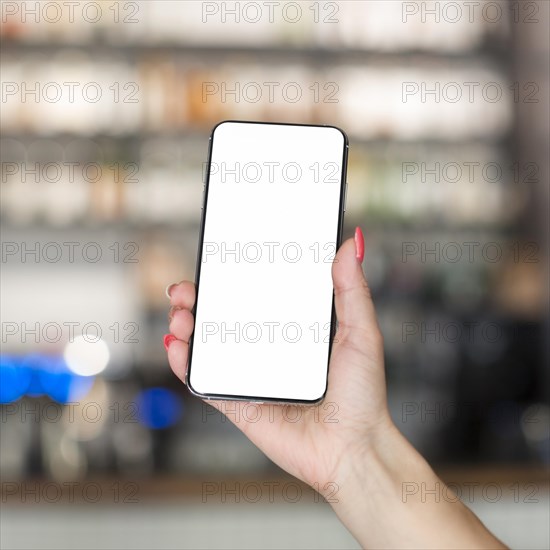 Woman holding smartphone with copy space