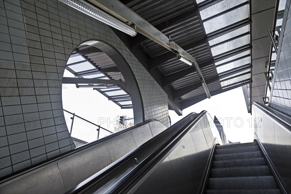 Escalator underground station Bockenheimer Warte with the top of the Messeturm