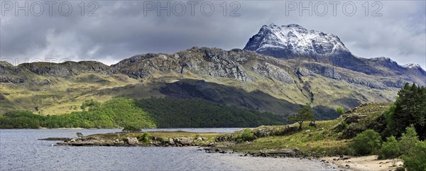 Loch Maree and the mountain Slioch covered in snow in spring