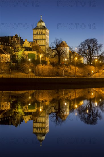 Gothic Burgtor Gate reflected in water of the Elbe Luebeck Canal