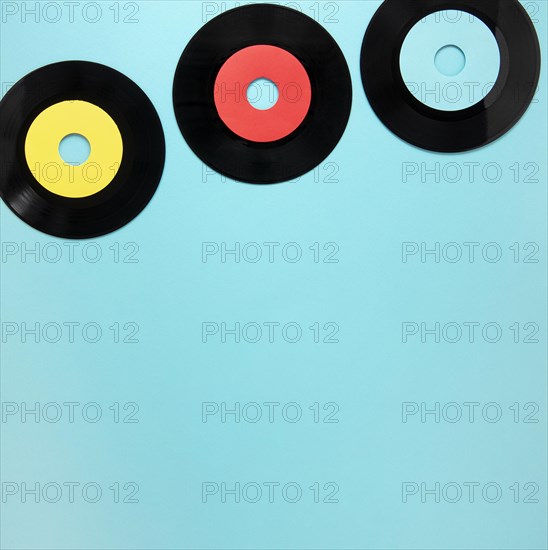 Old disc records blue background