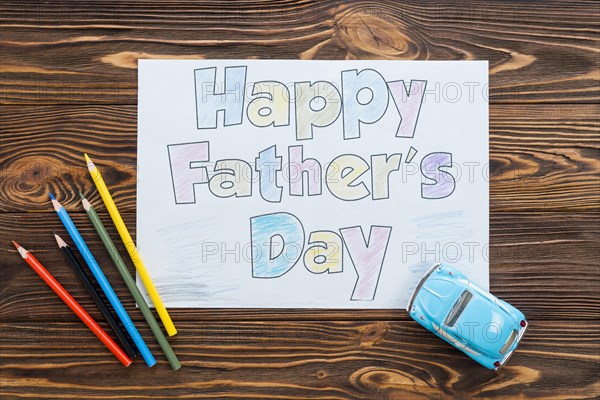 Happy fathers day inscription with toy car