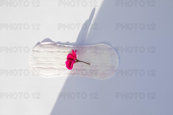 Top view sanitary towel with flower