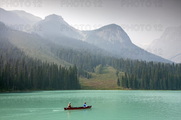 Tourists in red canoe on Emerald Lake