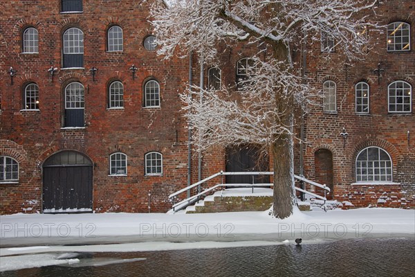 Historic salt warehouses in the snow in winter