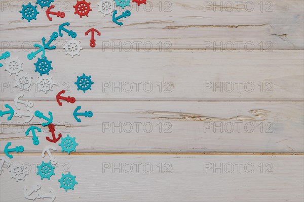 White wooden surface with colored summer items