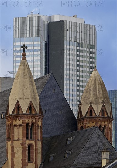 Old Catholic church of St Leonhard in front of modern skyscrapers