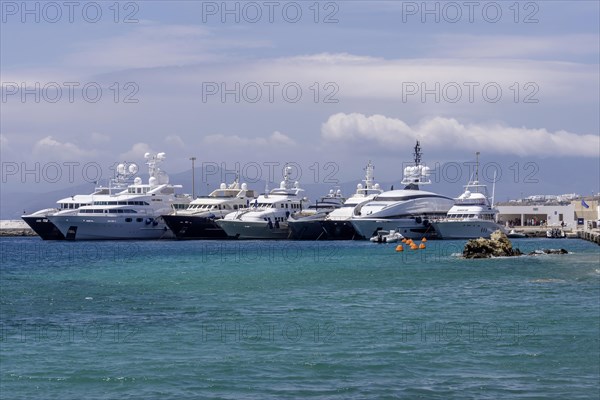 Luxury yachts anchored off the island of Mykonos