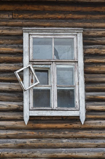 Window of derelict wooden building at Pyramiden