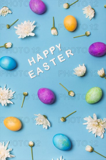 Happy easter title bright eggs flower buds