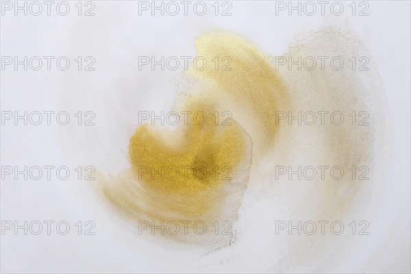 High angle view white canvas with yellow paint stains