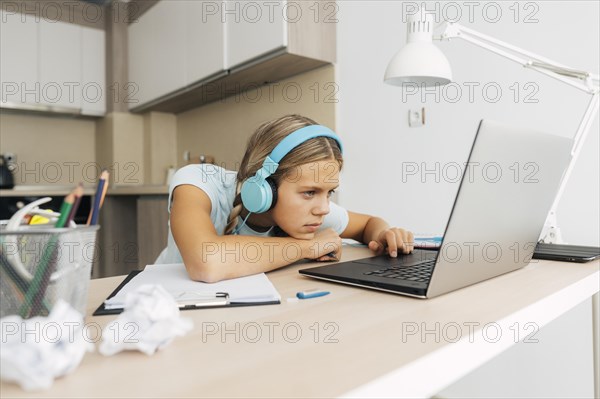 Young girl studying home