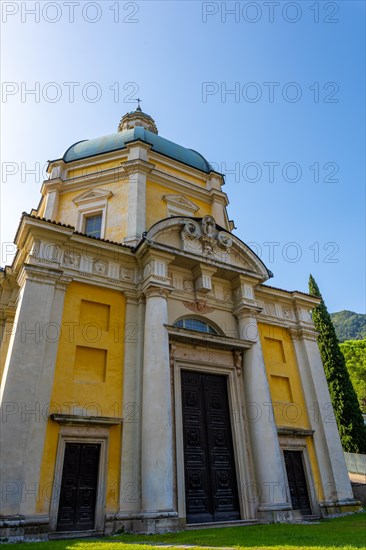 Temple of the Holy Cross Against Blue Clear Sky in a Sunny Day in Riva San Vitale