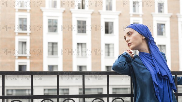 Side view girl wearing hijab with copy space
