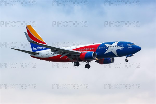 A Boeing 737-700 aircraft of Southwest Airlines with the registration number N931WN in the Lone Star special livery at Dallas Airport