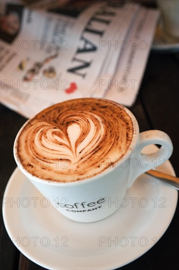 Cup of coffee with heart of milk foam