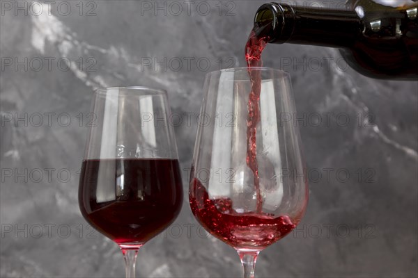 Wine bottle filling wineglass
