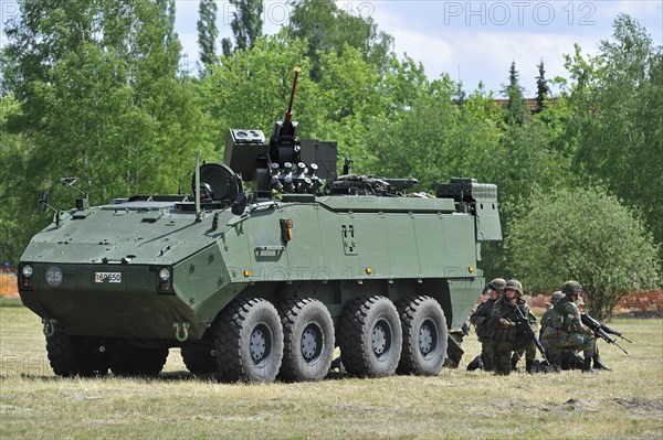 Demonstration of infantry soldiers fighting near MOWAG Piranha IIIC armoured fighting vehicle during open day of the Belgian army at Leopoldsburg