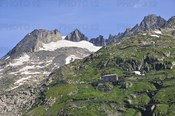 Road with hairpin curves winding over the Furka Pass in the Swiss Alps